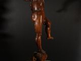 a bronze statue of an angel on a pedestal