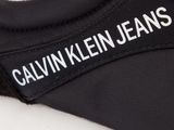 black and white sneakers with the name calvin jeans on the side