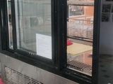 an image of a microwave oven sitting on top of a counter