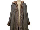 an image of a coat with a fur collar on a mannequin dummy