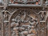 a wooden carving of a nativity scene on display