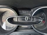 a close up of a car dashboard with a speedometer and gauges