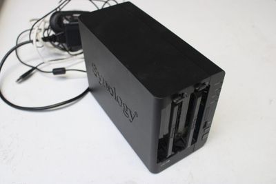 an image of a black charger on a white table