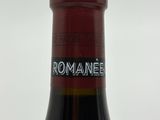 a bottle of wine that is sitting on a table