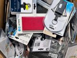 a cardboard box full of electronic devices and electronics