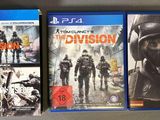 deux jaquettes de jeux vidéo représentant la division et la division posée sur une table