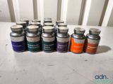 several bottles of medicine are lined up on a table