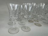 many empty wine glasses lined up on the table