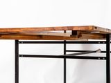 an image of a wooden desk with a metal frame underneath it