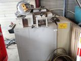 a machine that is sitting on a pallet in a garage
