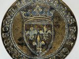 a close up of a coin with a crown on it