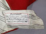 a close up of a label on a red and white jacket
