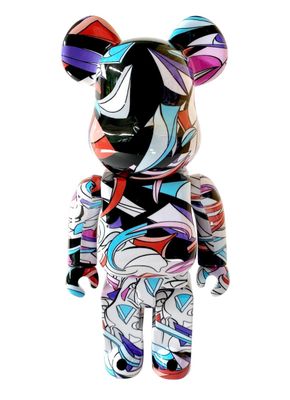 the bear is multicolored and has many designs on it