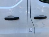 a close up of a white van with a number plate on it