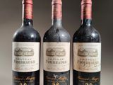 three bottles of wine sitting on top of a table next to each other