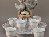 a table with a bunch of cups and saucers on it