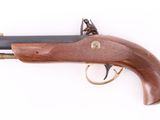 an old gun with a wooden handle on a white background
