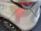 a close up of a car ' s tail light on the side of the car