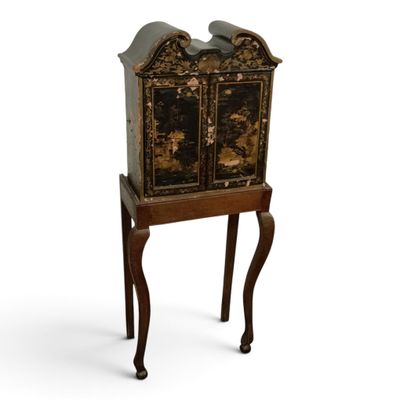 an image of a small cabinet on a stand on a white background
