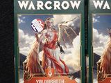 two boxes of wargrow war cards on a table