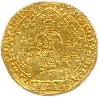 a gold coin with an image of a woman on it