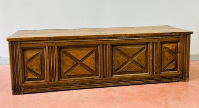 a wooden bench with a wooden top on the floor