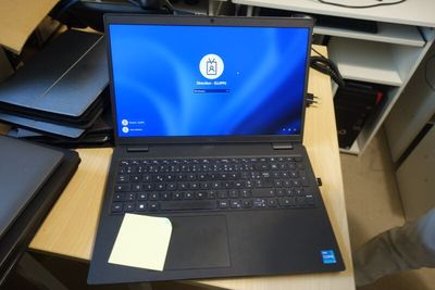 a laptop that is sitting on a desk in a room