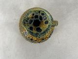 an image of a small vase with a hole in it