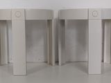 pair of round side tables in the style of person