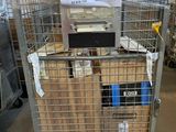 a metal cart with a lot of boxes on top of it