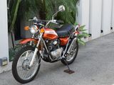a motorcycle that is parked in front of a building