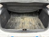 a trunk of a car with the back of it ' s trunk open