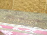 a close up of a wooden box with writing on it
