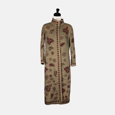a dress with a floral pattern on the front and a long sleeve