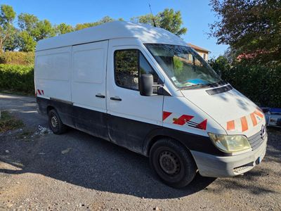 a white van that is parked on the side of the road