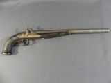 an old gun that is on display on a table