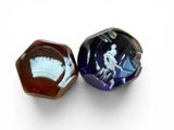 pair of blue and white glass figurines of a man and a woman
