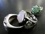 a couple of rings sitting on a table next to each other
