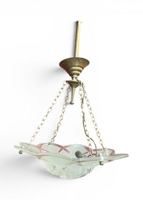 brass and glass chandelier hanging from a chain with a bird on it
