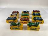 six toy cars sitting in a row on a table