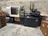 a machine that is sitting in a room with pallets