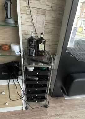 a view of a room with a lot of shelves and a chair