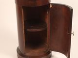 an image of a wooden cabinet with a marble top