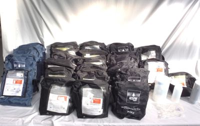many bags of coffee on a table with a white cloth