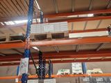 a large warehouse with a lot of shelves and pallets