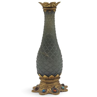 an image of a green vase with a gold base on a white background