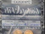 deux pièces d'or dans un sachet en plastique muni d'une étiquette de prix