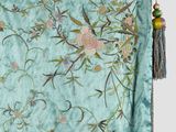 an image of a close up of a blue blanket with flowers on it
