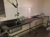 a kitchen with a sink and a sink in it
