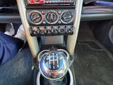 a close up of a car ' s dashboard with a steering control